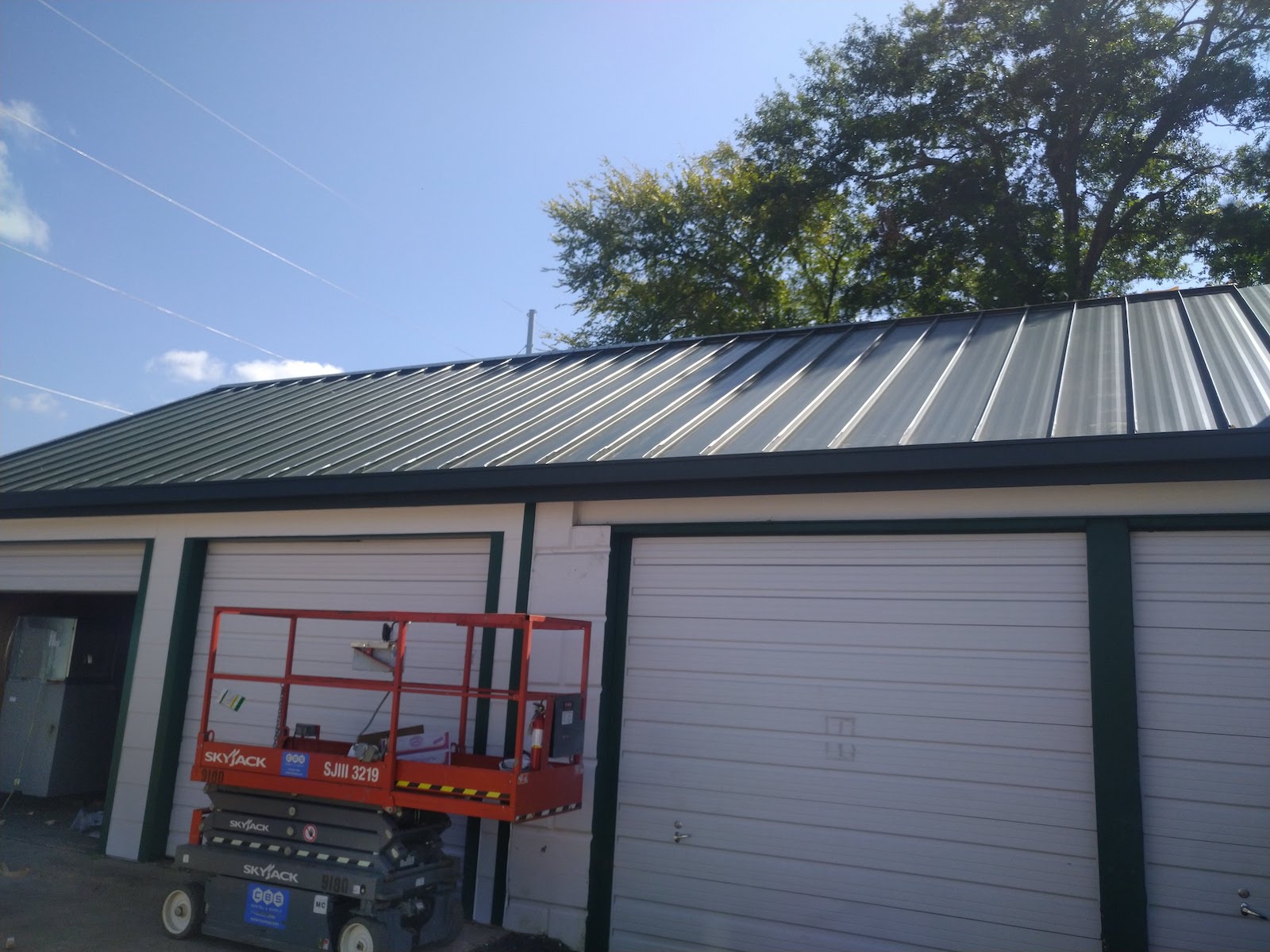 choice one restoration staff installing metal commercial roof